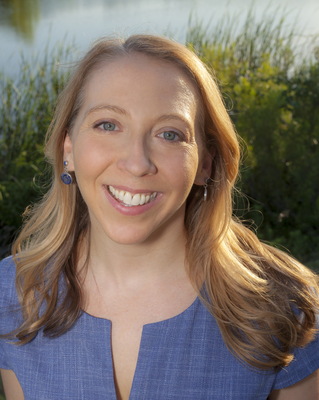 A professional portrait of Renee Brown